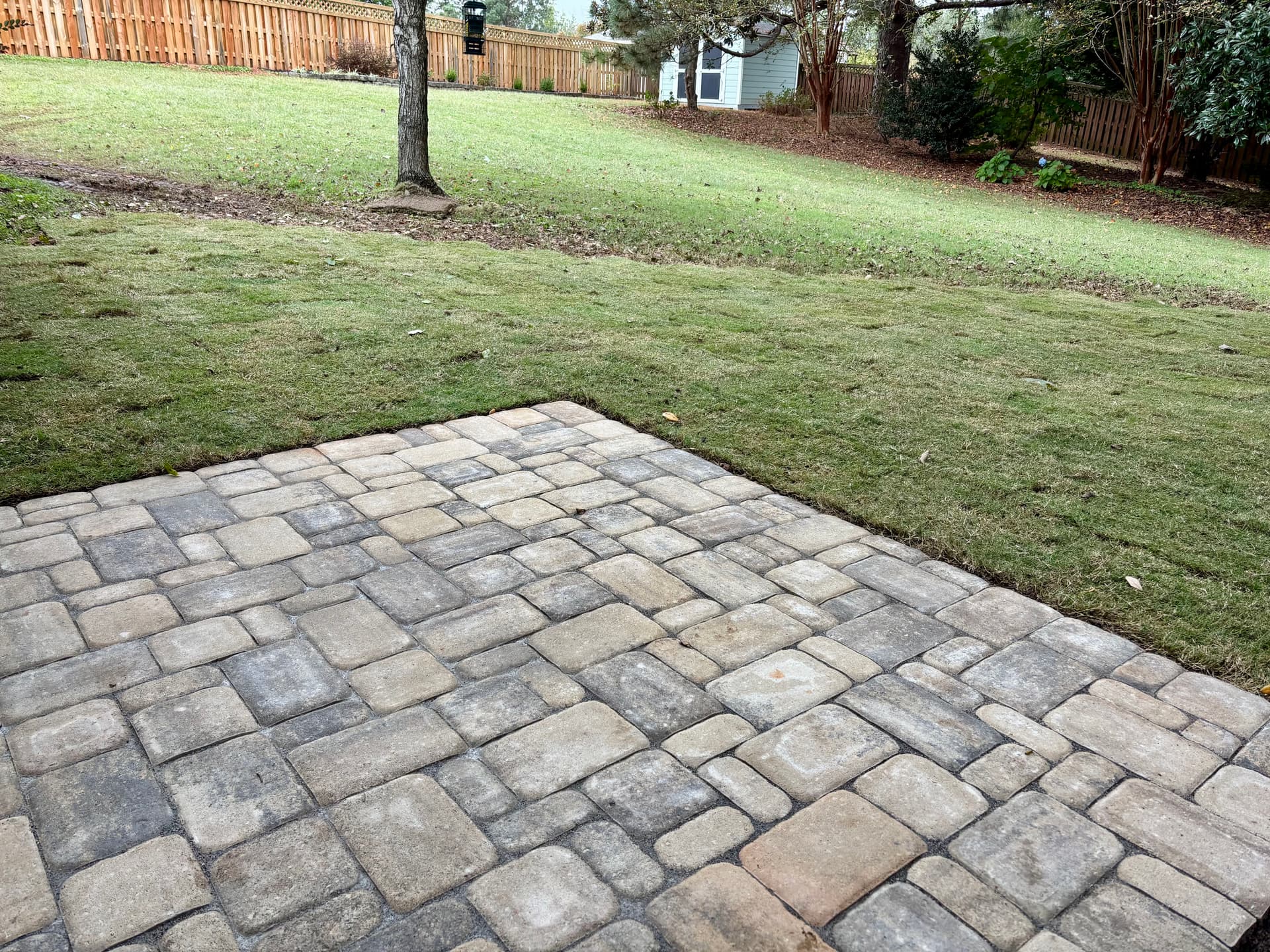 Cobble Patio and Lush Lawn Makeover image