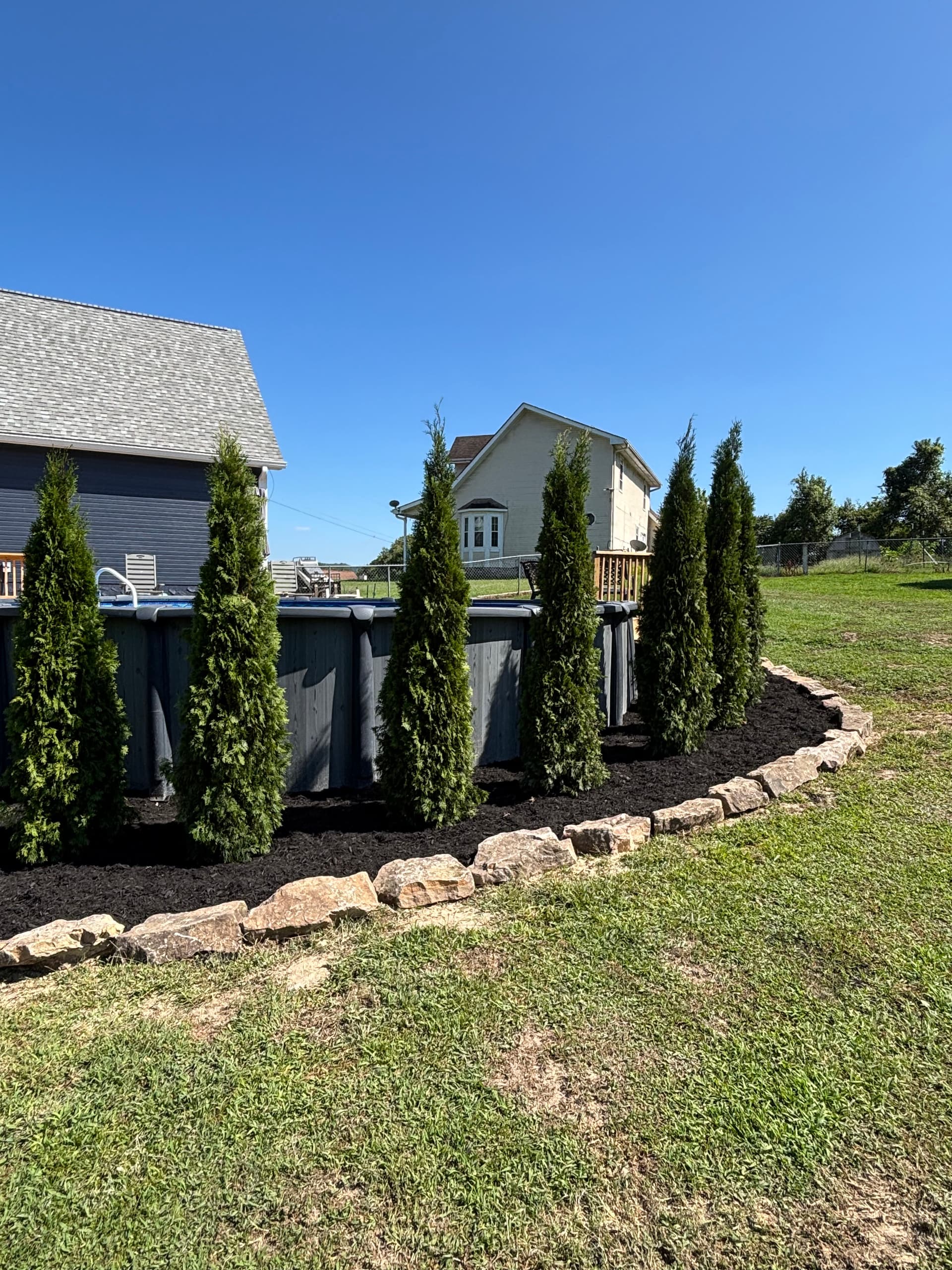 Gallery photos for Boulder Wall, Fresh Plantings and Pool Privacy Screen in Ringgold: Image #2